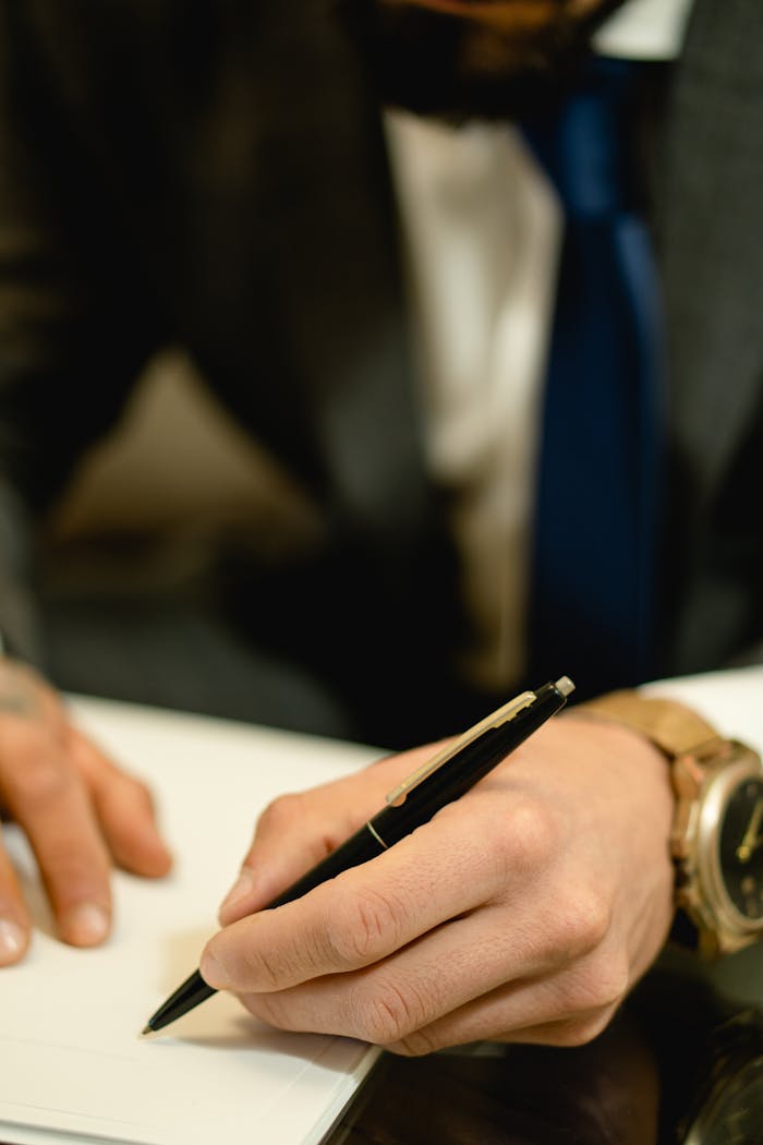 services-05 Close-up of hand signing a legal contract with a pen. Ideal for business and legal themes.